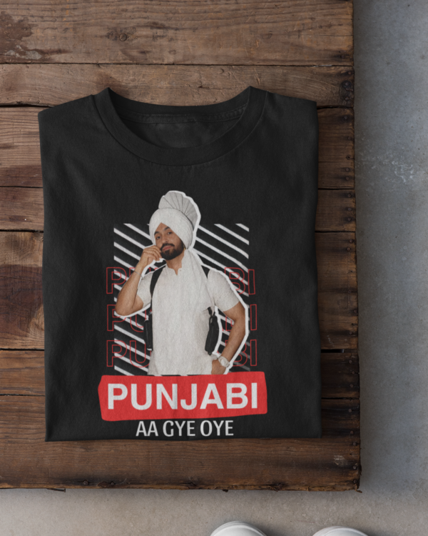 folded-tee-mockup-against-a-wooden-surface-33685 (3) Punjabi Aa Gye OYE Unisex T-Shirt