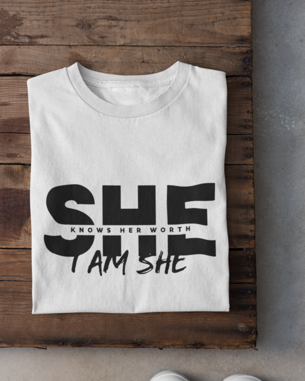 folded-tee-mockup-against-a-wooden-surface-33685 (5) She Knows Her Worth I Am She Woman's T-Shirt