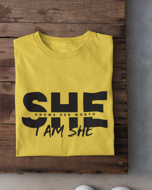 folded-tee-mockup-against-a-wooden-surface-33685 (6) She Knows Her Worth I Am She Woman's T-Shirt
