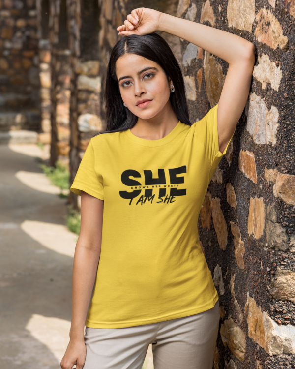 round-neck-tee-mockup-of-a-woman-leaning-over-a-rock-wall-m25834 She Knows Her Worth I Am She Woman's T-Shirt