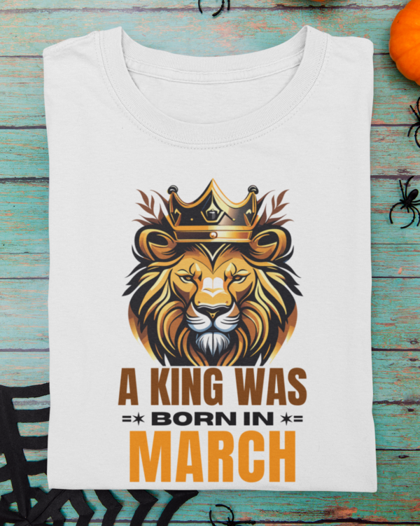 mockup-of-a-folded-t-shirt-featuring-halloween-decor-items-m100 (2) A King Was Born in March Unisex T-Shirt
