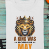 mockup-of-a-folded-t-shirt-featuring-halloween-decor-items-m100 (4) A King Was Born in May Unisex T-Shirt