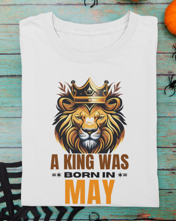 mockup-of-a-folded-t-shirt-featuring-halloween-decor-items-m100 (4) A King Was Born in May Unisex T-Shirt