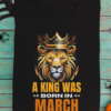mockup-of-a-folded-t-shirt-featuring-halloween-decorations-m101 (4) A King Was Born in March Unisex T-Shirt