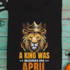 mockup-of-a-folded-t-shirt-featuring-halloween-decorations-m101 (5) A King Was Born in April Unisex T-Shirt
