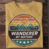 Wanderer by Nature T‑Shirt (Retro Travel Badge – Beige)