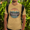 Wanderer by Nature T‑Shirt (Retro Travel Badge – Beige)