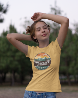 tee-mockup-featuring-a-teen-girl-in-a-field-20735 Wanderer by Nature T‑Shirt (Retro Travel Badge – Beige)